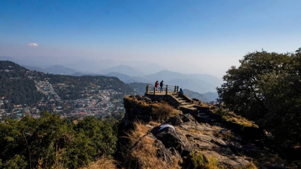 Group of individuals atop Tiffin Top, Lansdowne, admiring the expansive valley view.
